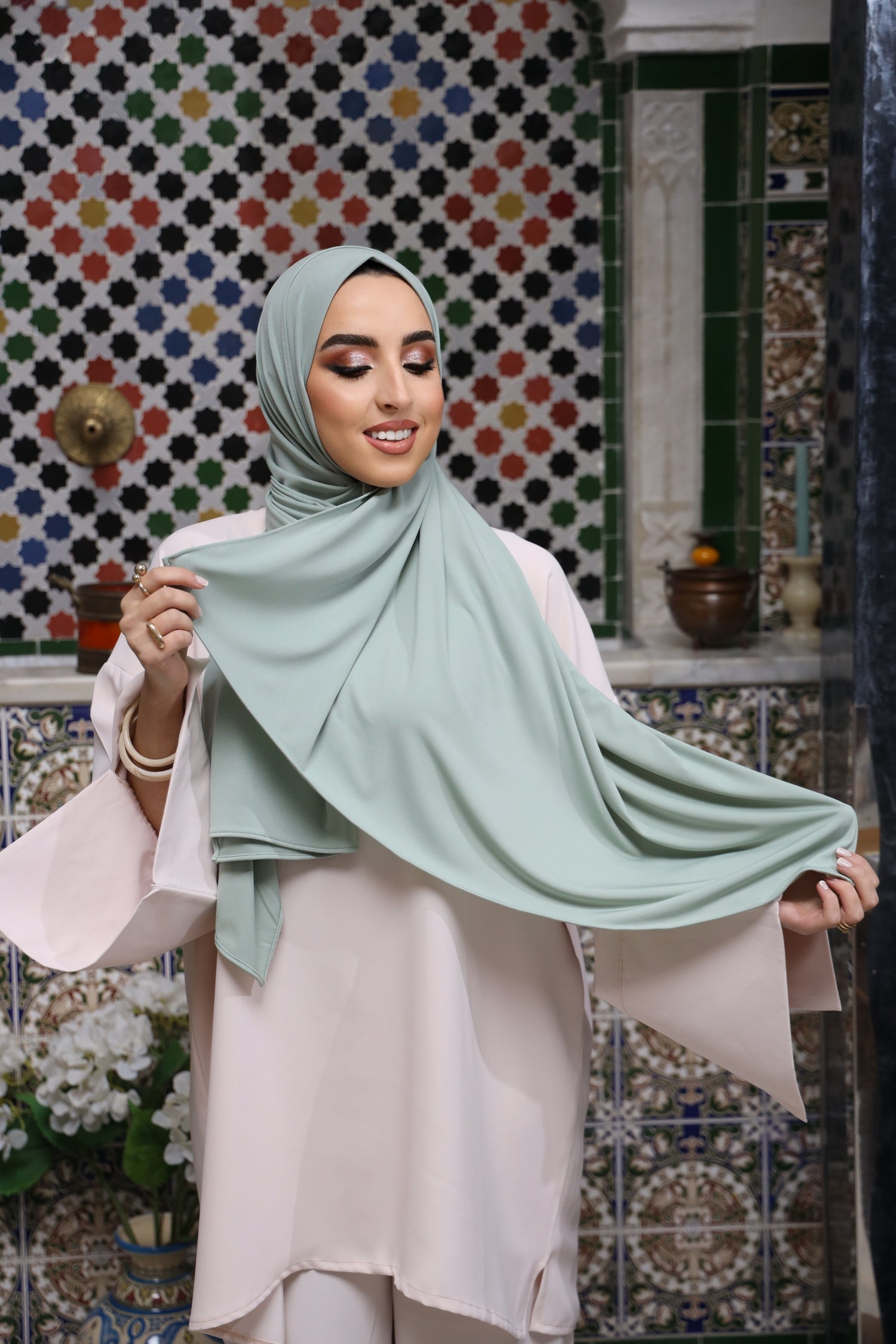 Model wearing CHANO Modesty’s Premium Jersey Hijab in Mint Blue—soft, stretchable fabric with full coverage and a smooth, elegant drape for everyday modest wear.