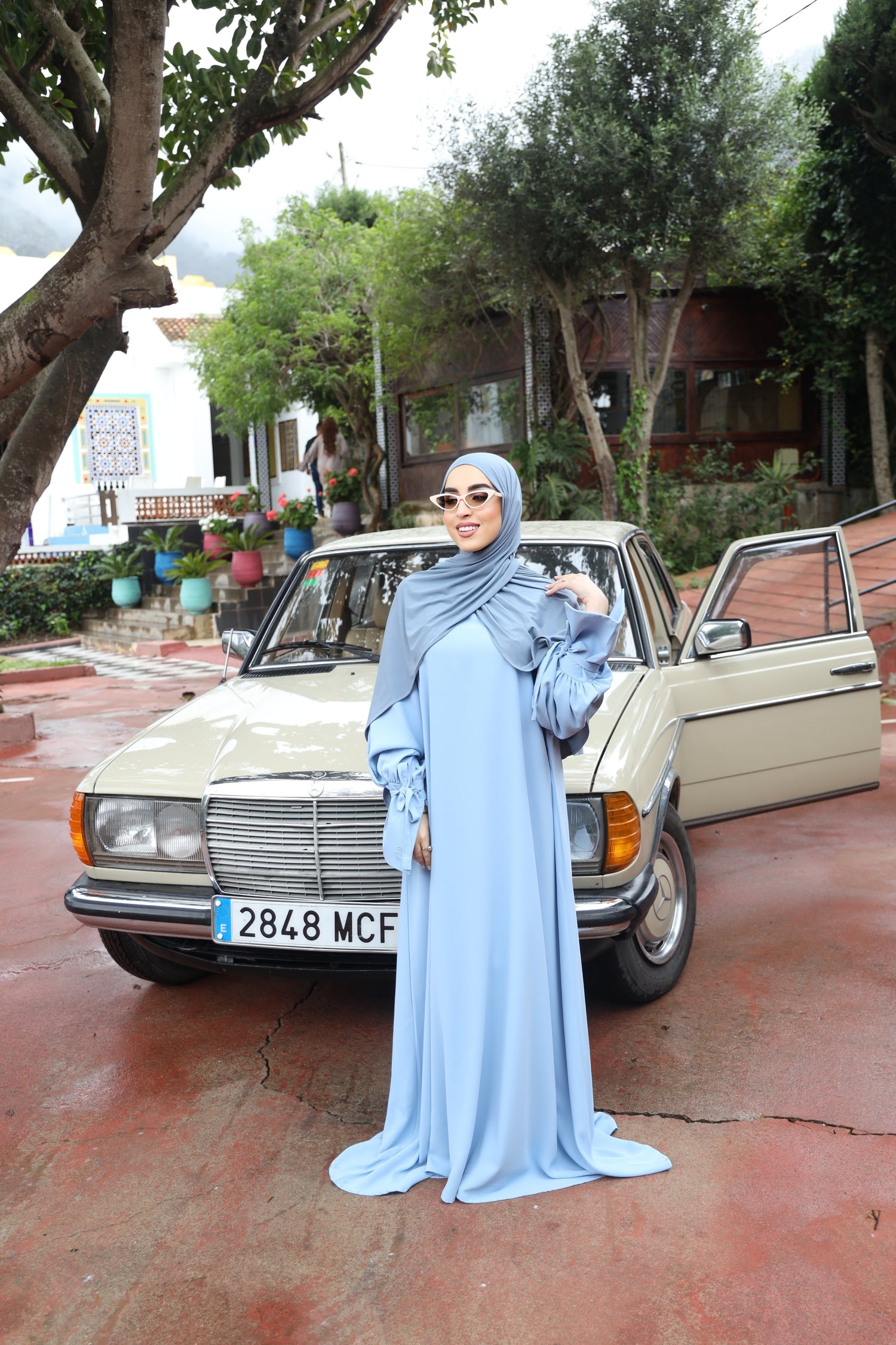 Model wearing the full-length Balloon Sleeve Dress in Sky Blue by CHANO Modesty, showcasing its flowing silhouette and elegant modest design.