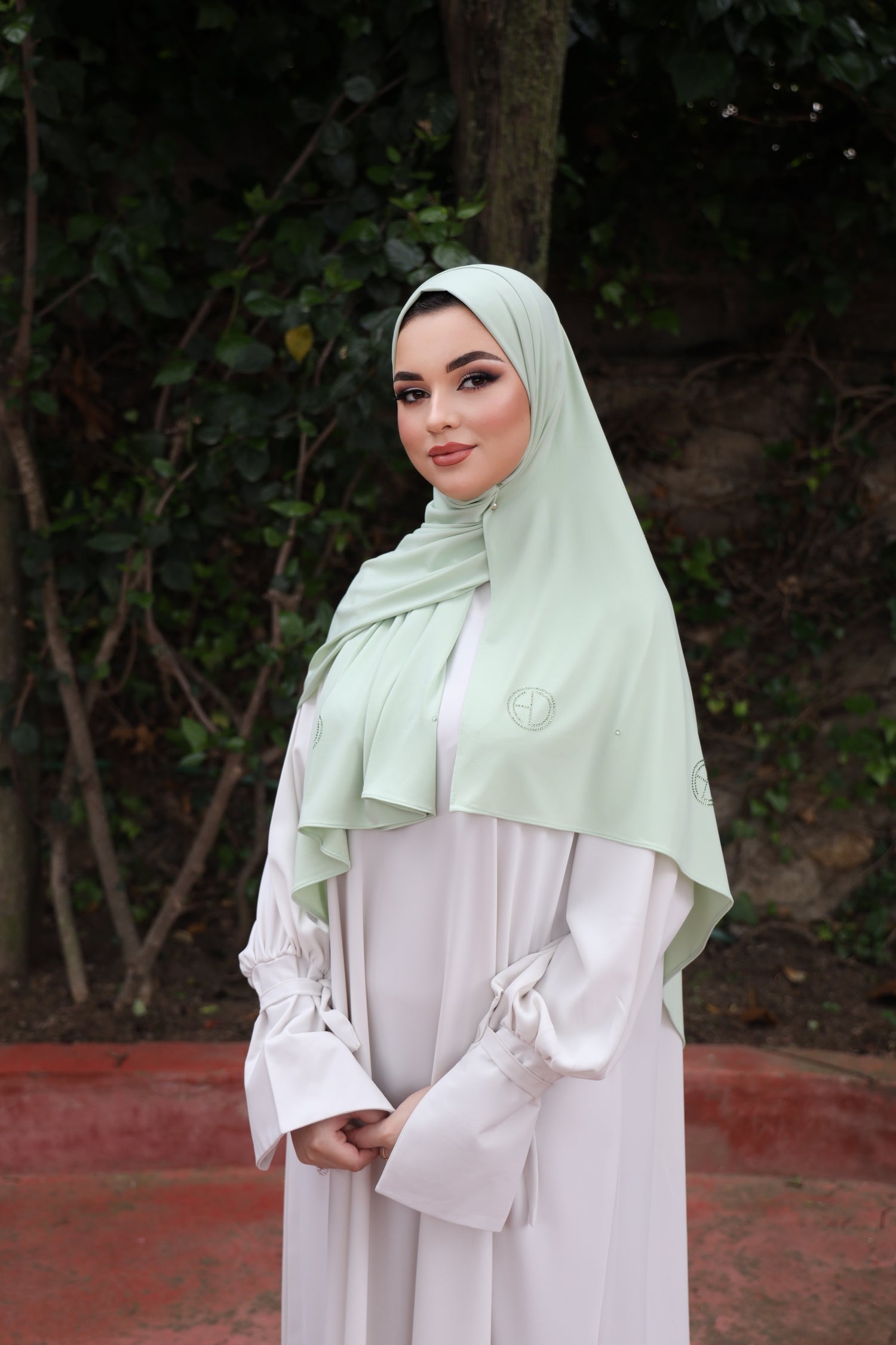 Model wearing the CHANO Modesty Premium Jersey Hijab stone in Pastel Green —soft, flowy jersey styled effortlessly for full coverage and timeless elegance.