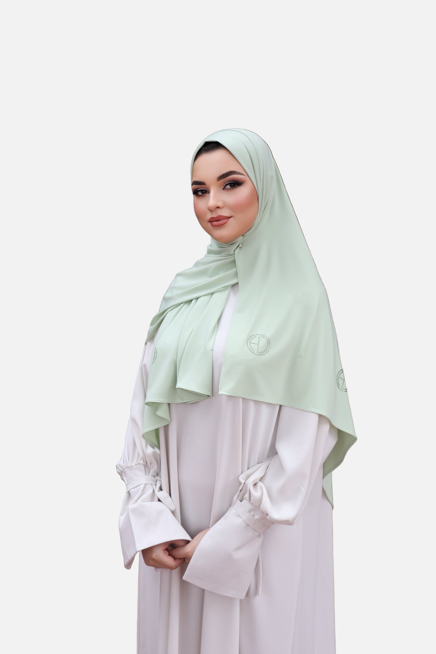 Model wearing the CHANO Modesty Premium Jersey Hijab stone in Pastel Green —soft, flowy jersey styled effortlessly for full coverage and timeless elegance.