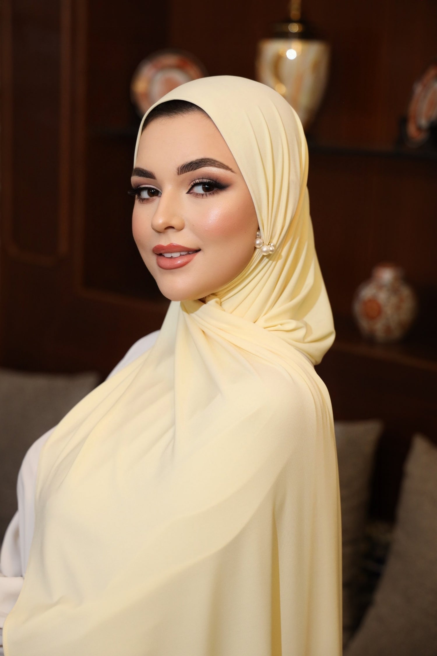 Model wearing CHANO Modesty’s Premium Jersey Hijab in Butler Yellow—soft, stretchable fabric with full coverage and a smooth, elegant drape for everyday modest wear.
