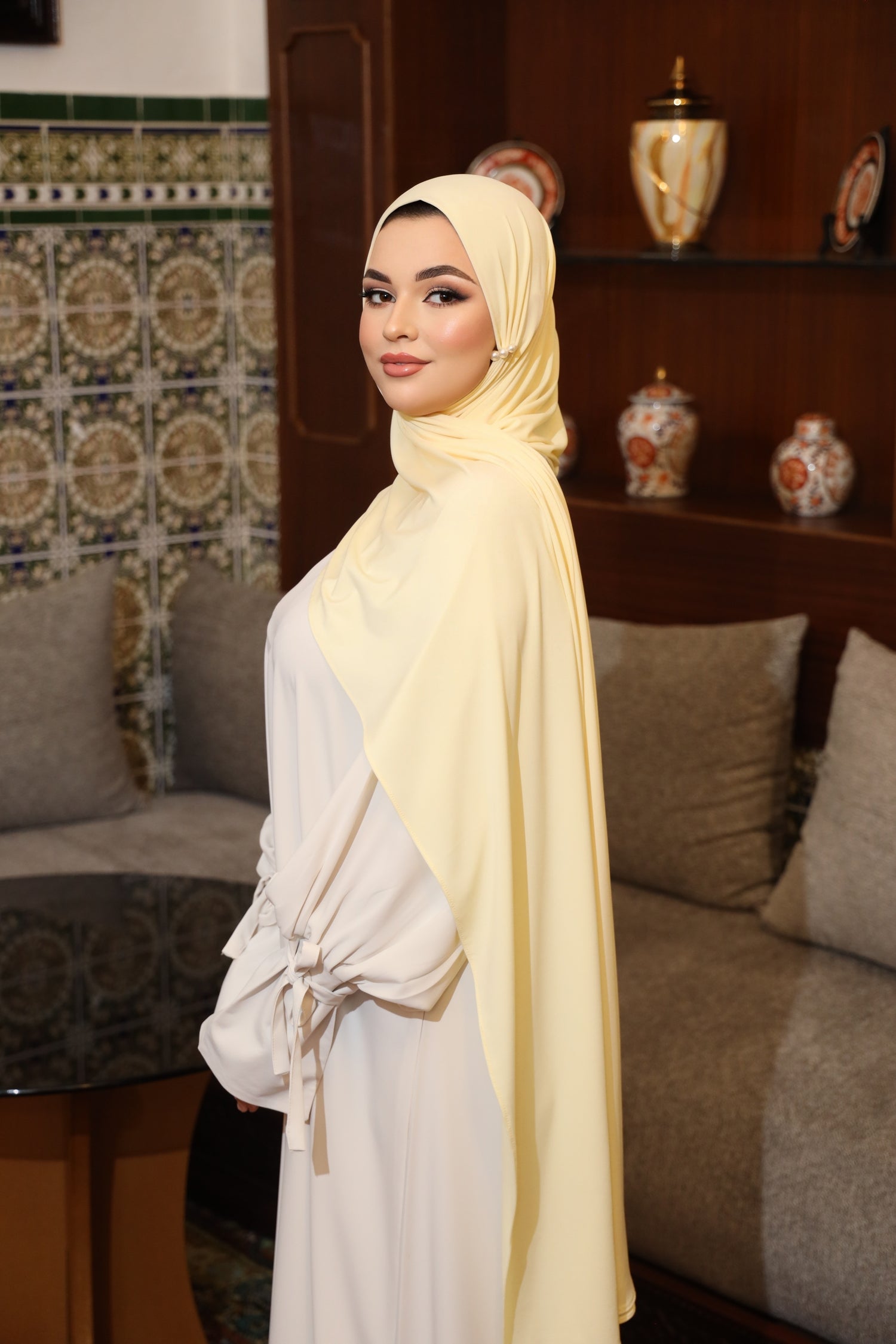 Model wearing CHANO Modesty’s Premium Jersey Hijab in Butler Yellow—soft, stretchable fabric with full coverage and a smooth, elegant drape for everyday modest wear.