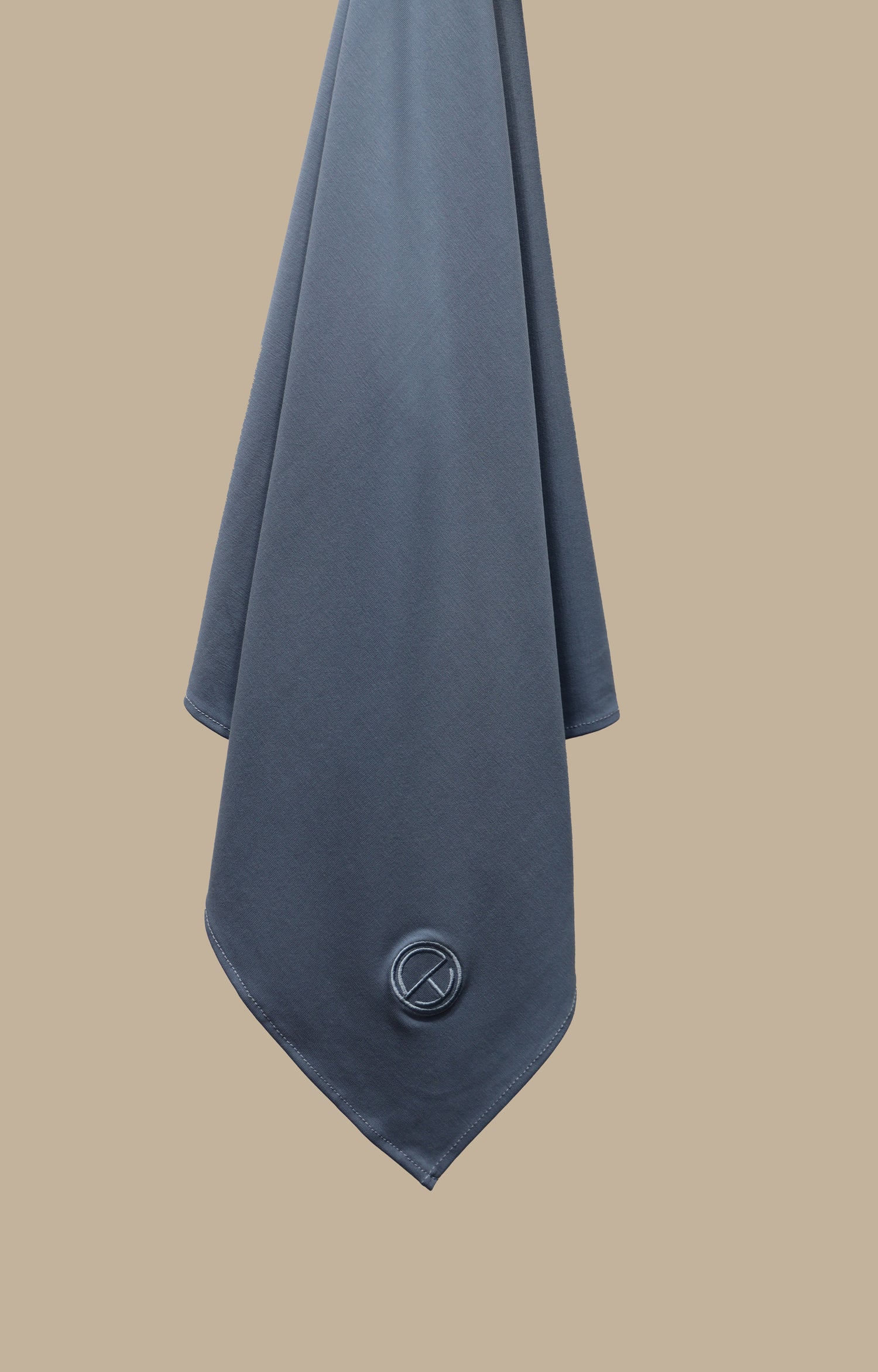 Close-up of the breathable modal jersey hijab in Ash Blue with embroidered CHANO logo.