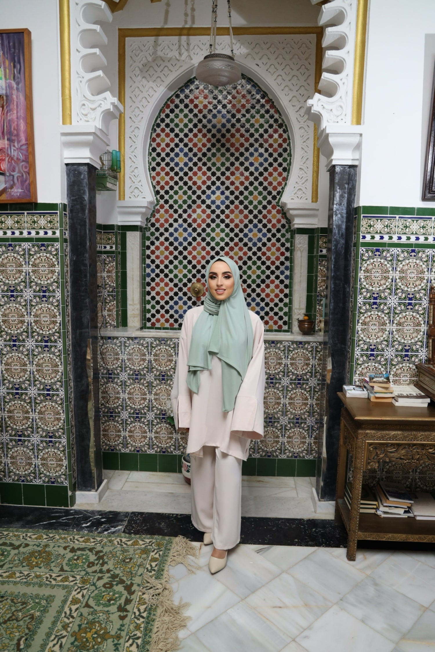 Model wearing a flowy Blush Beige twinset featuring an oversized tunic with wide sleeves and matching loose-fit trousers.