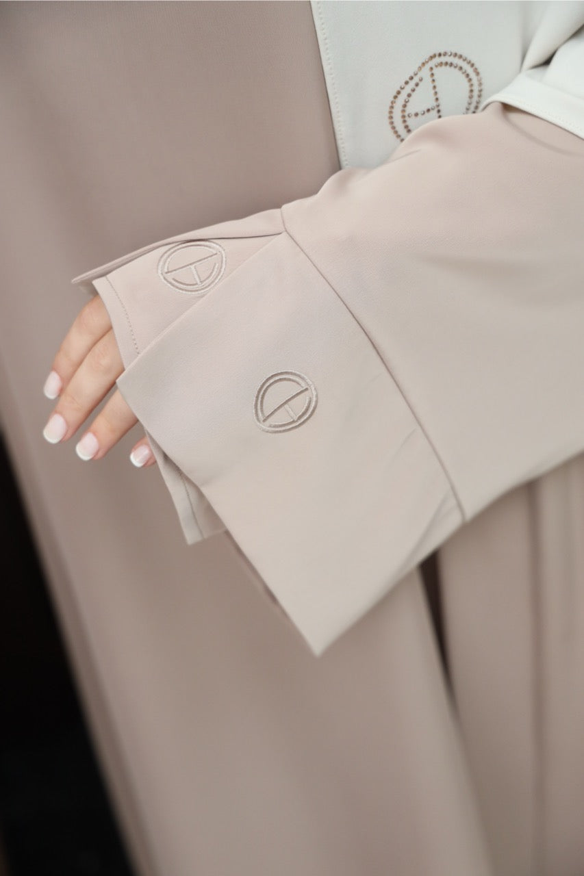 Embroidery sleeve of the taupe two-piece satin abaya.