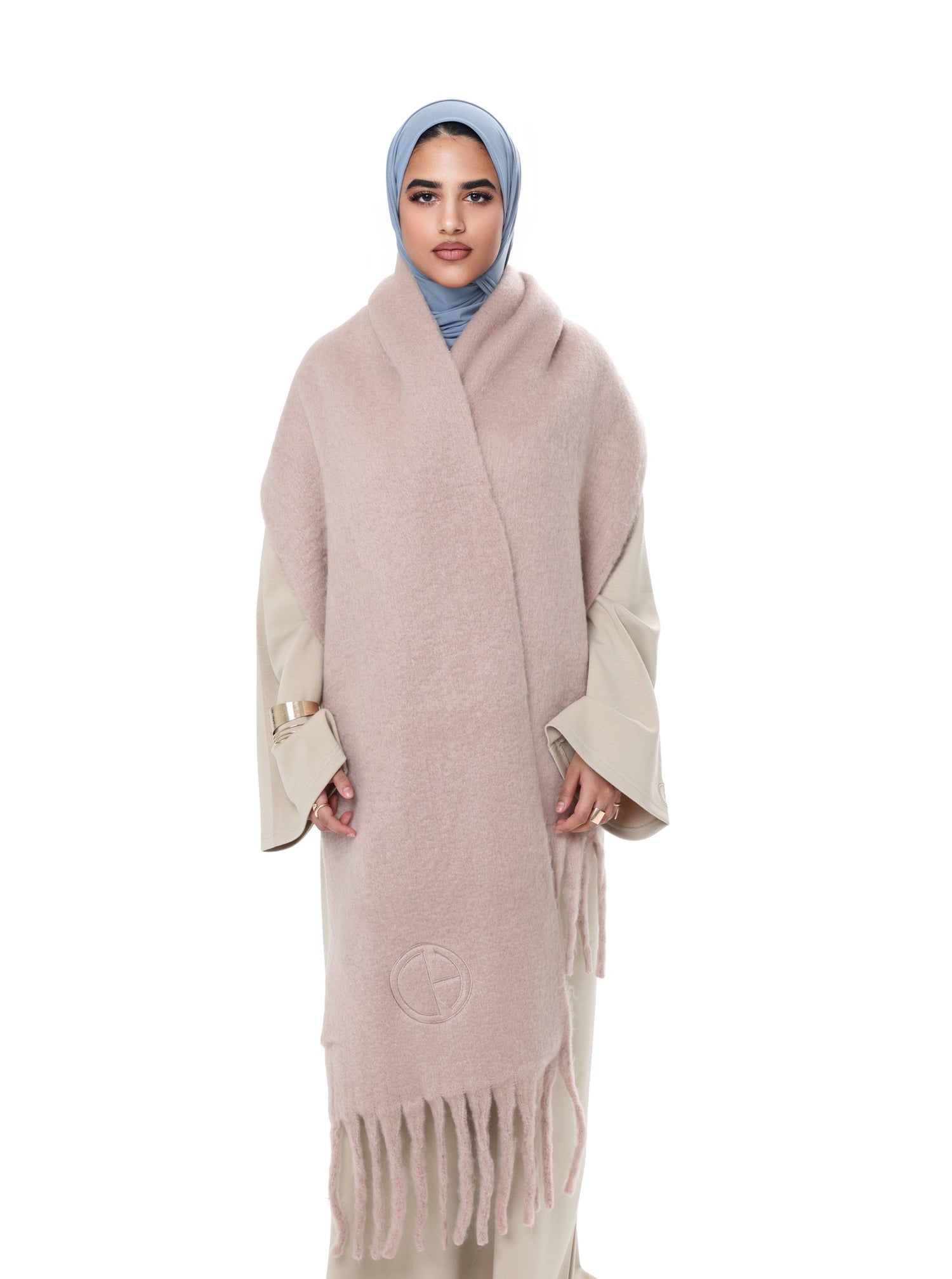 Front view of model wearing the Comfy Scarf in Beige, styled over a beige comfy dress and blue hijab, showcasing the soft brushed texture and elegant oversized fit.