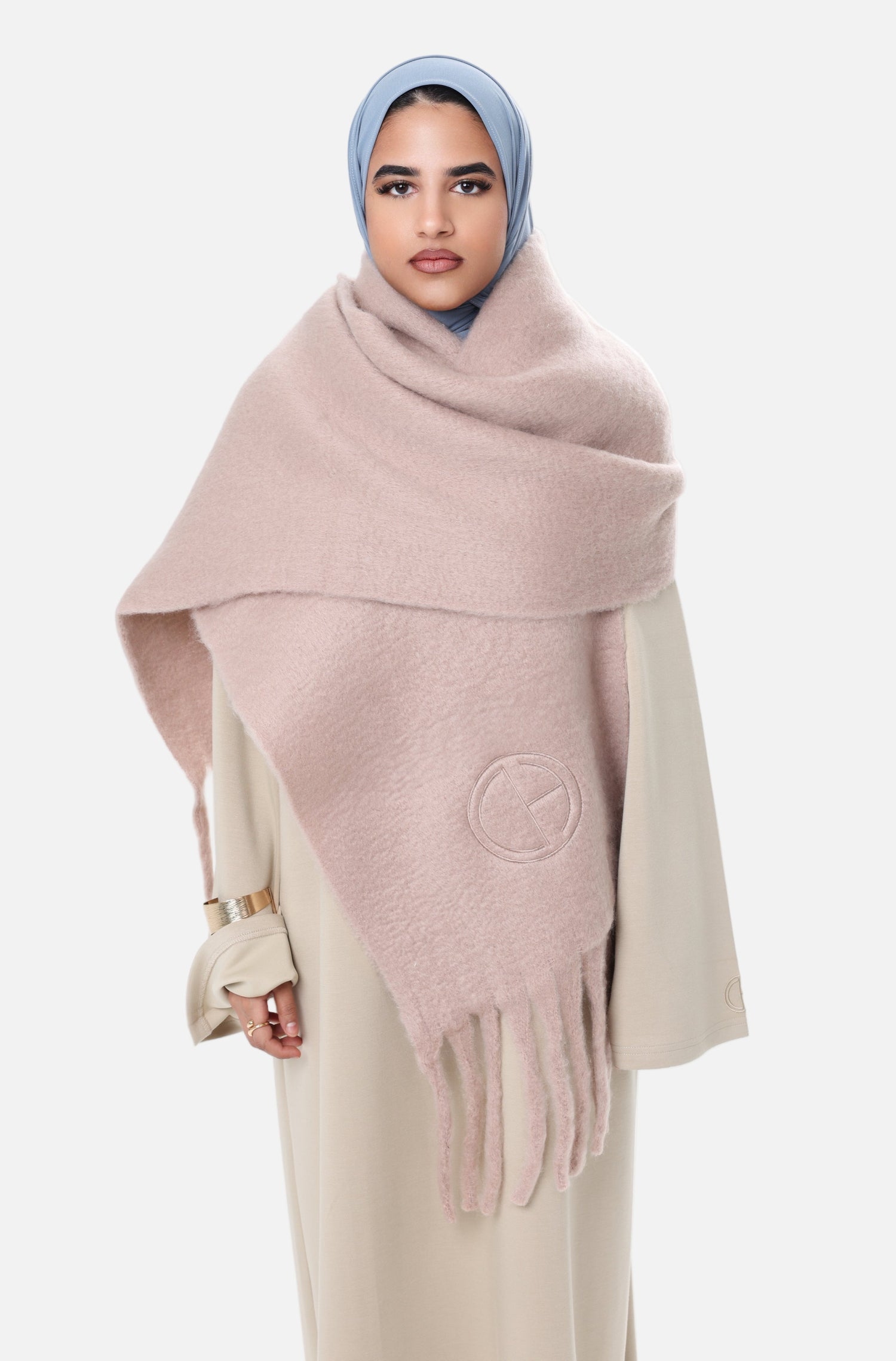 Front view of model wearing the Comfy Scarf in Beige, styled over a beige comfy dress and blue hijab, showcasing the soft brushed texture and elegant oversized fit.