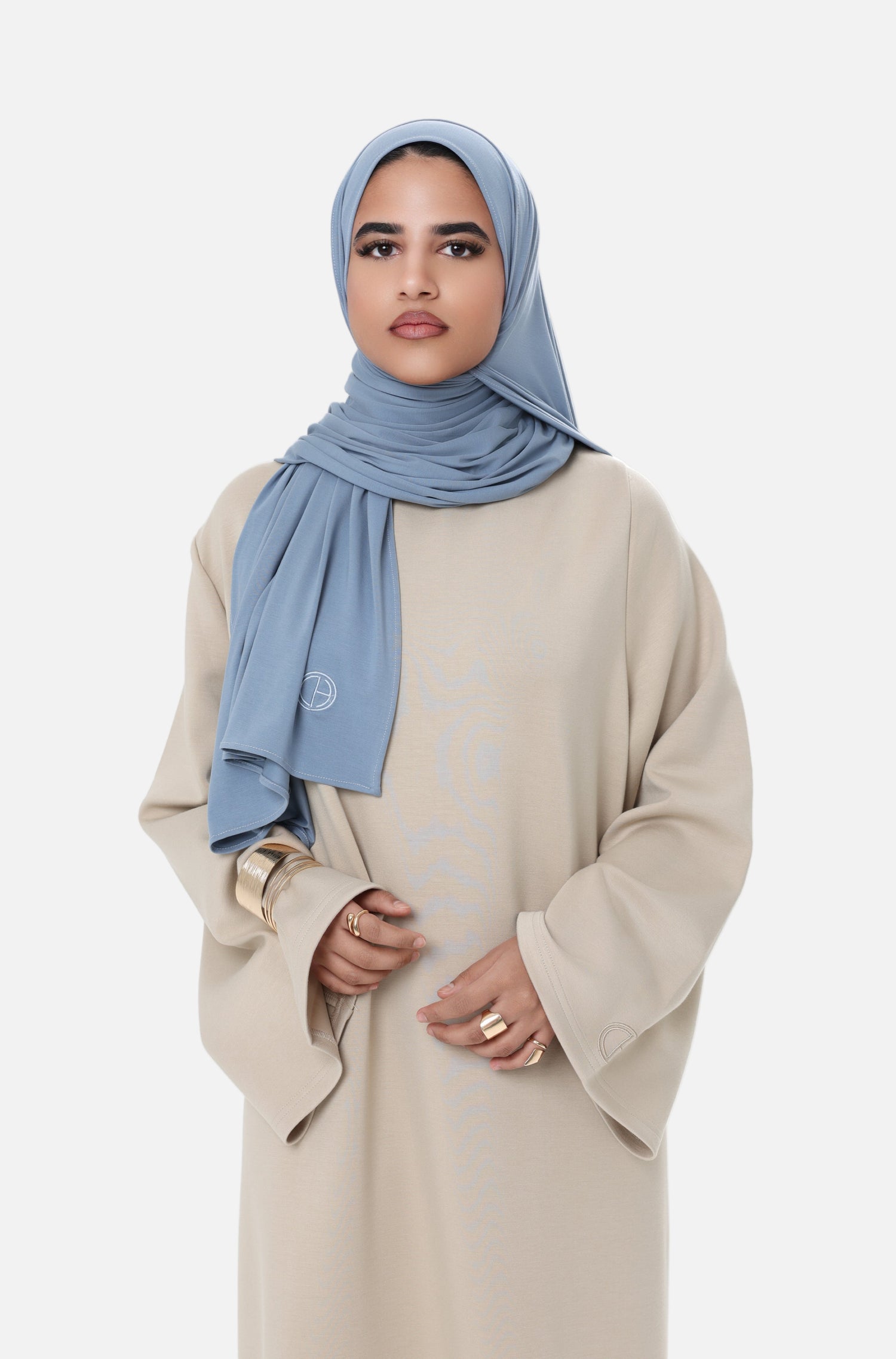 Close-up of the Comfy Dress in Beige, focusing on the soft texture and minimal design with wide sleeves.