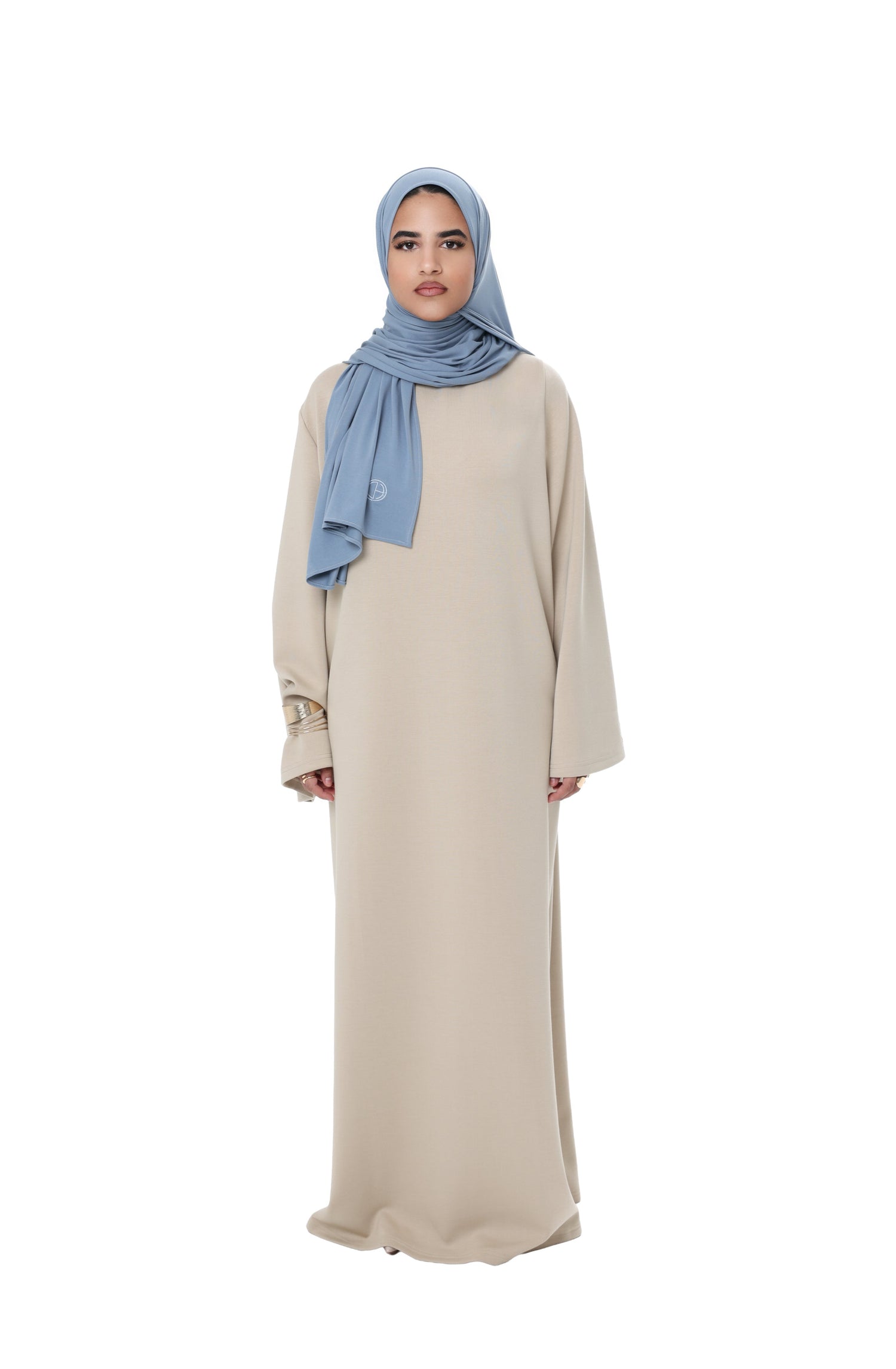 Front view of the Comfy Dress in Beige, a long modest dress with a relaxed fit and clean, timeless look.