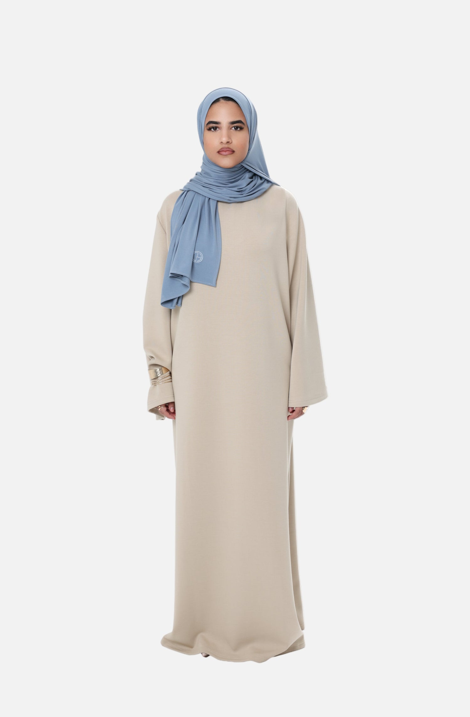 Front view of the Comfy Dress in Beige, a long modest dress with a relaxed fit and clean, timeless look.