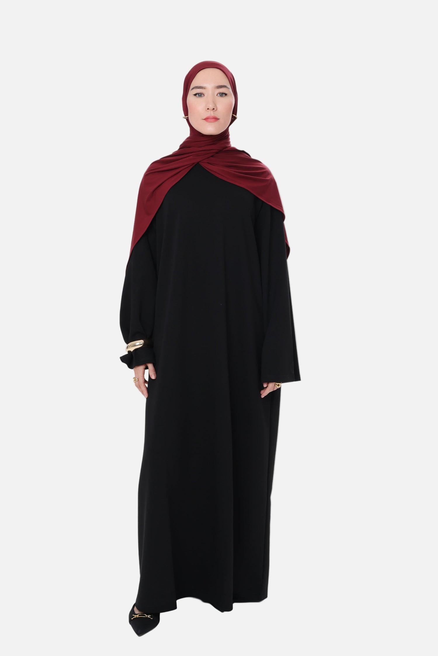 Front-facing photo of the Comfy Dress in Black featuring a clean, minimal design and wide sleeve detail.