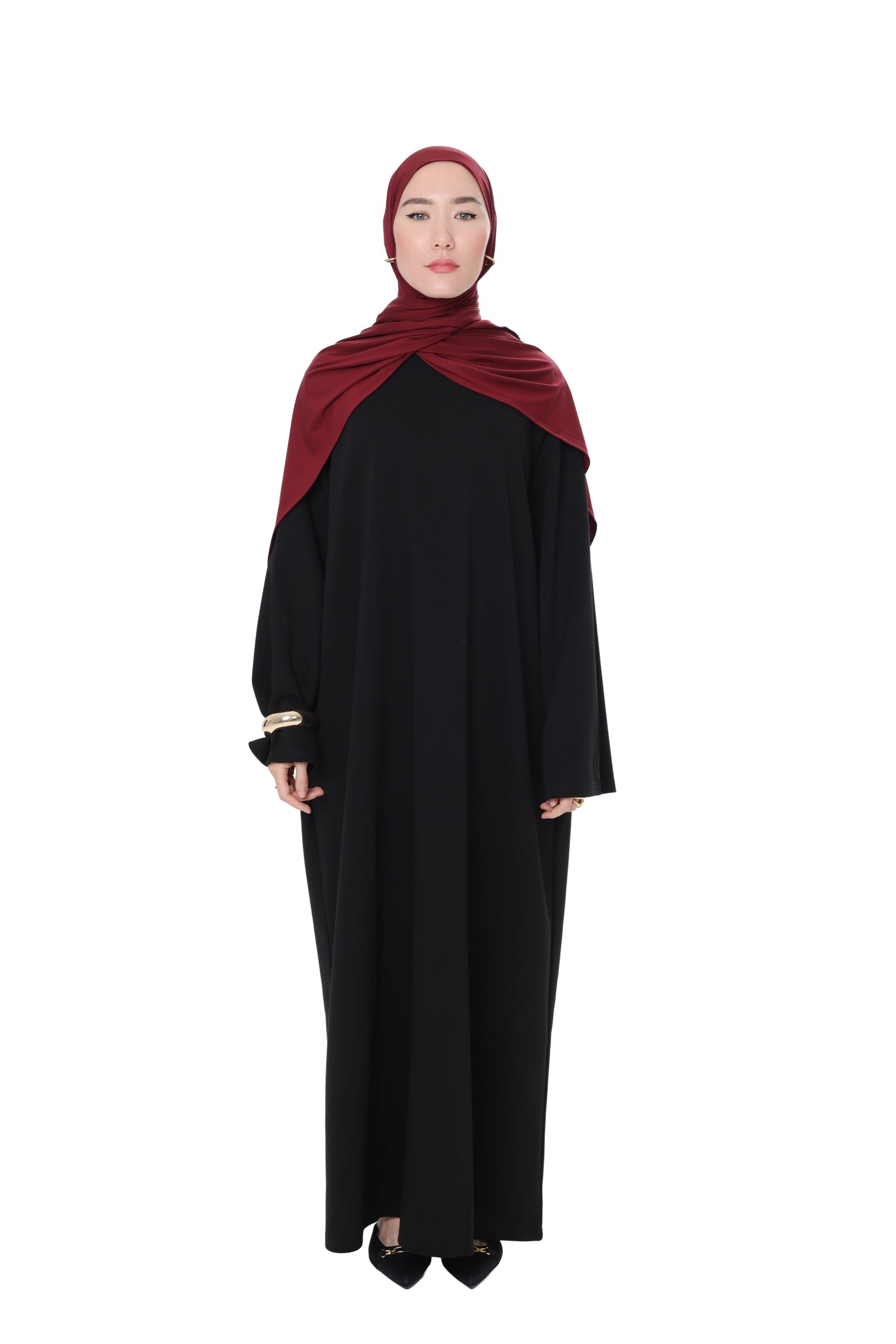 Full front view of the Comfy Dress in Black, paired with a burgundy hijab, showing the flowy, elegant fit.
