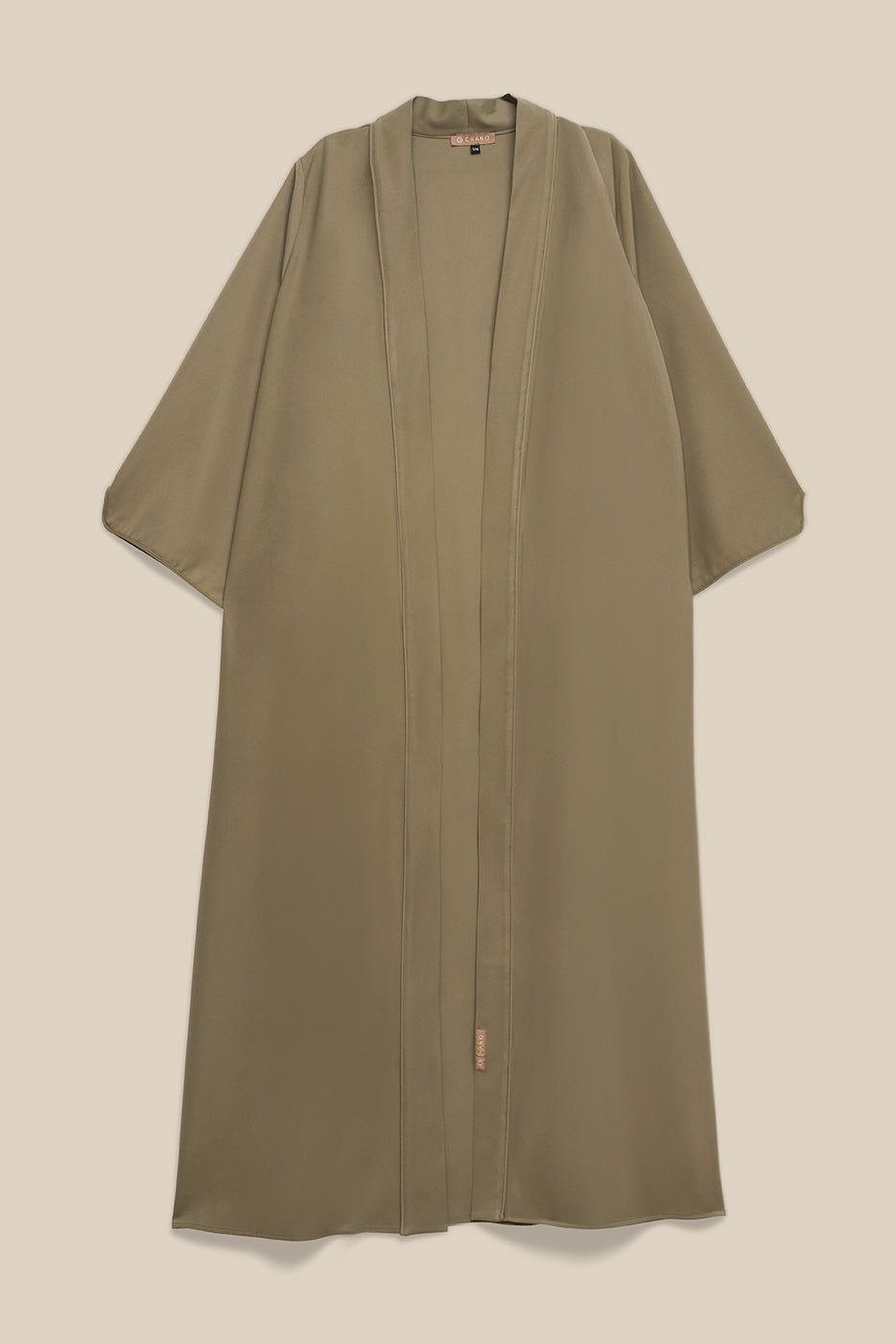 Elevate your modest wardrobe with our elegant two-piece staple abaya set in light sage. This versatile set includes a long-sleeve dress with a discreet back zipper and a classic abaya overlay that drapes beautifully for a timeless look.
