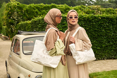 This tote bag is made from durable recycled cotton canvas, the bag features a spacious main compartment with a wide opening.