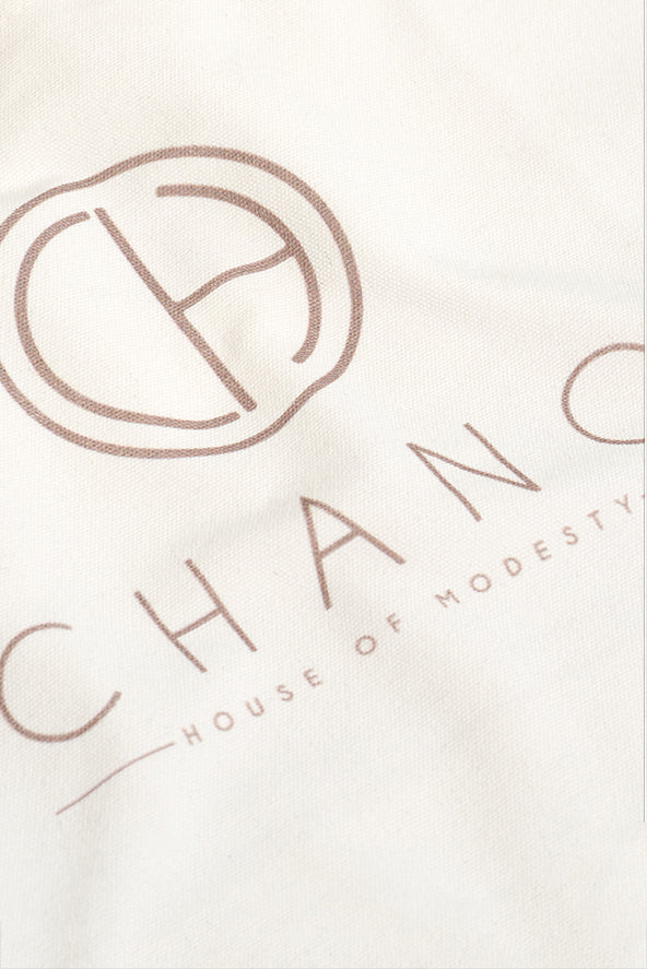 This tote bag is made from durable recycled cotton canvas, the bag features a spacious main compartment with a wide opening.
