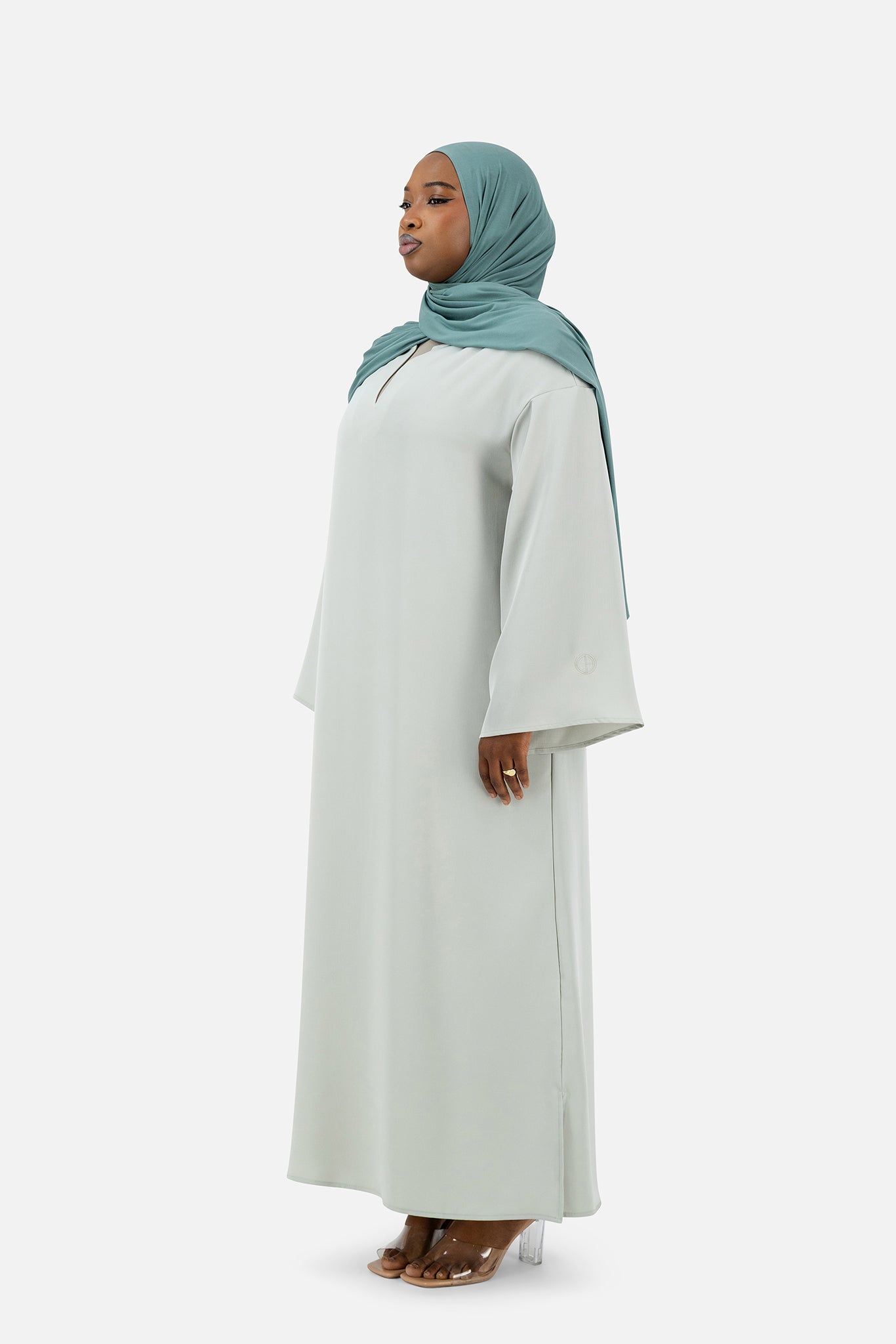 Elegant Misty Blue abaya set featuring layered details and relaxed fit