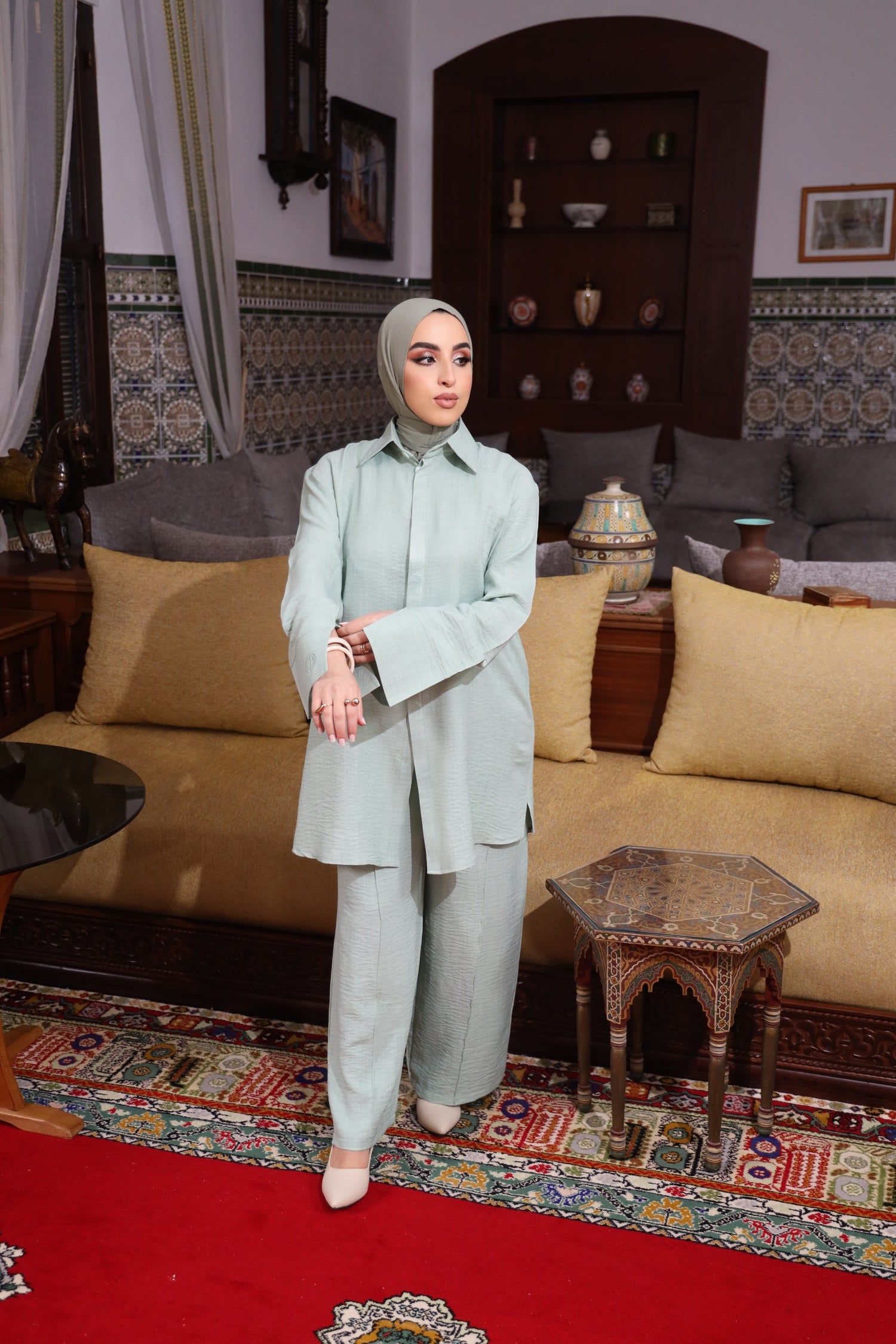 Modest fashion textured two-piece set in pastel green – loose-fit tunic and wide-leg pants styled with an instant bamboo hijab. 