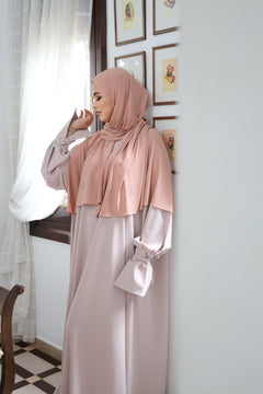 Model wearing the CHANO Modesty Premium Jersey Hijab stone in Peach Blush —soft, flowy jersey styled effortlessly for full coverage and timeless elegance.