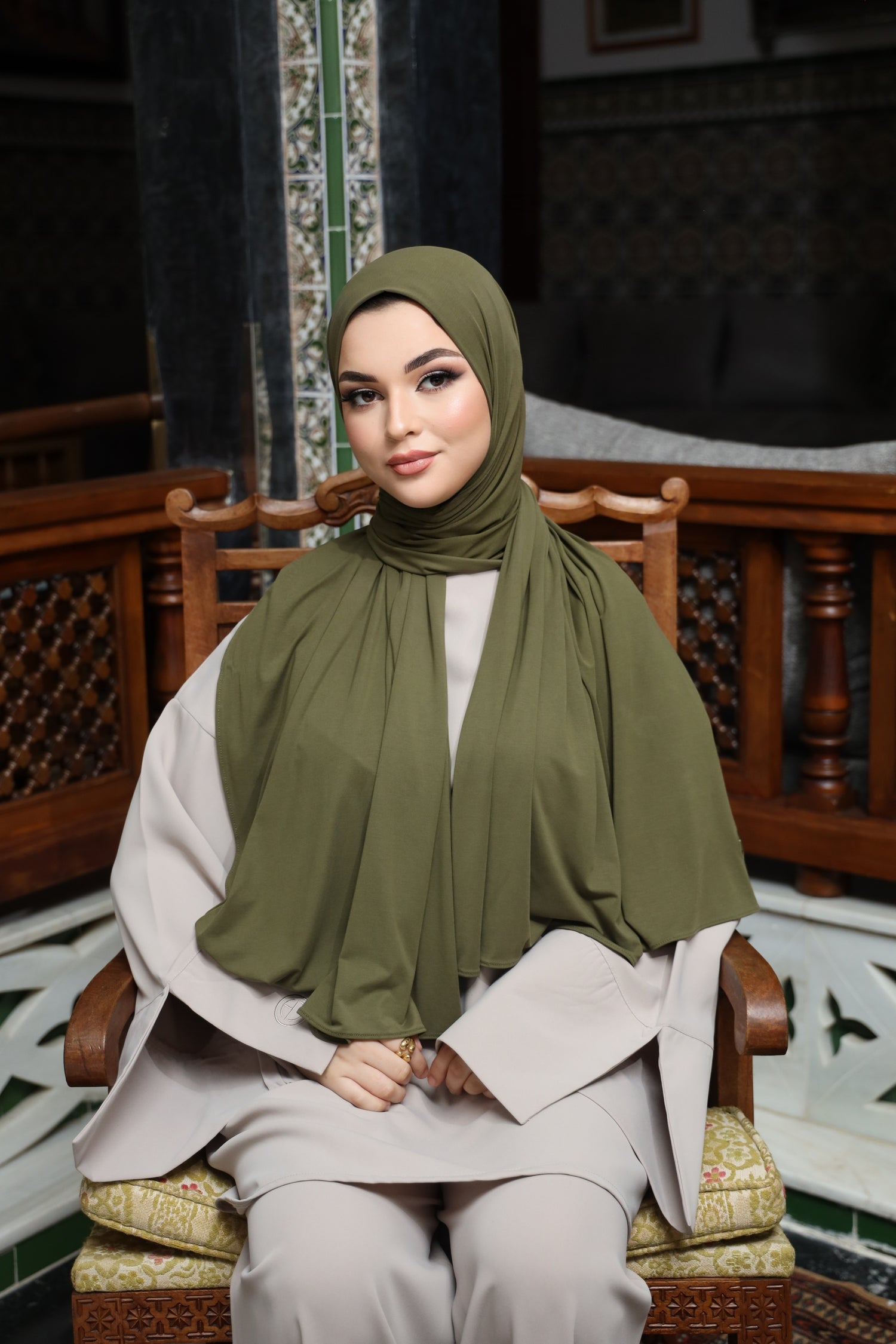 Model wearing CHANO Modesty’s Olive Green breathable modal jersey hijab, styled with a modest neutral-toned outfit for an elegant everyday look.
