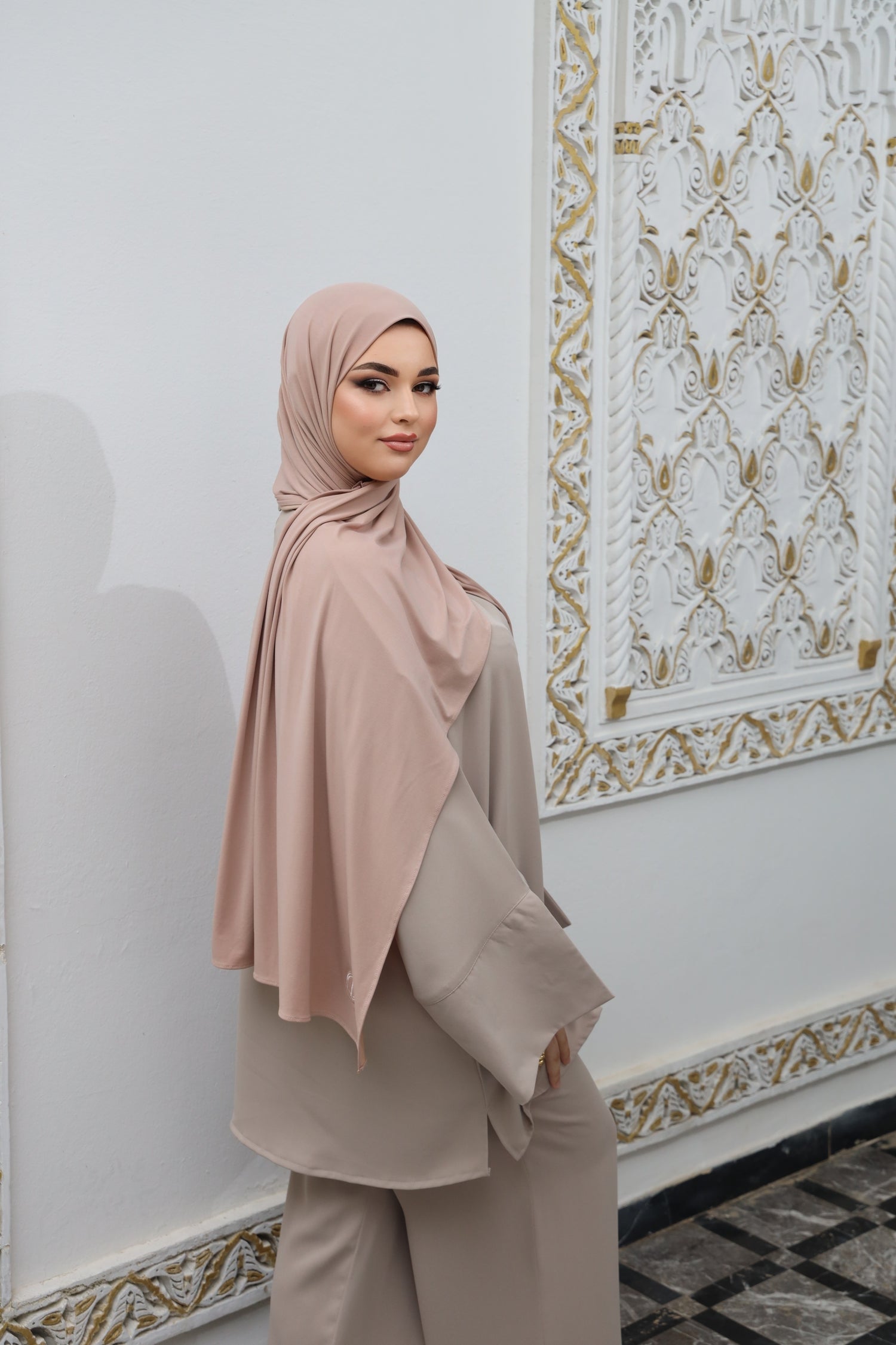 Model wearing CHANO Modesty’s Rosé Sand breathable modal jersey hijab, styled with a modest neutral-toned outfit for an elegant everyday look.