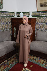 Model wearing CHANO Modesty’s Textured Tunic Dress in soft brown, a relaxed modest fit with wide sleeves and a buttoned collar — perfect for effortless elegance.