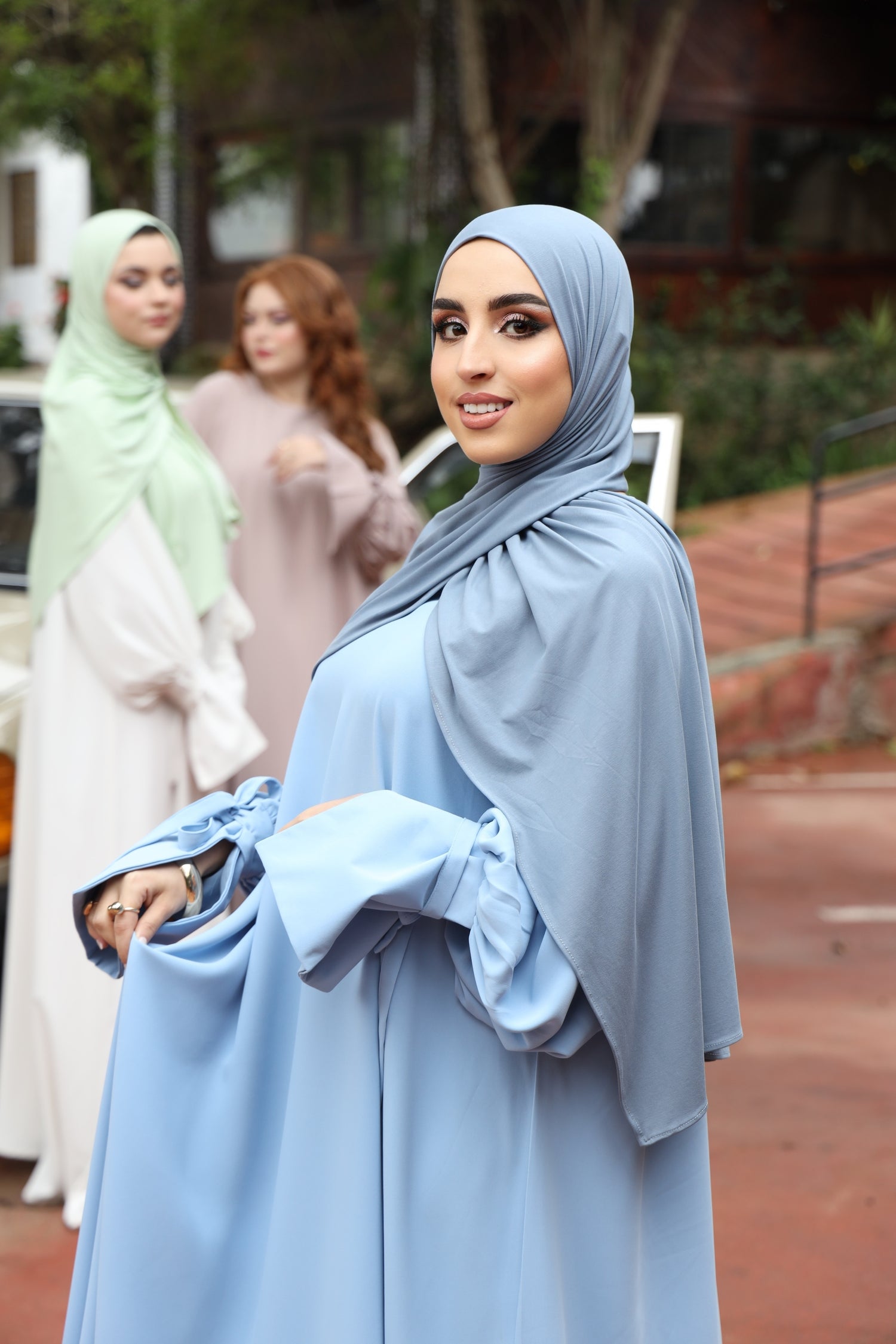 Model wearing CHANO Modesty’s Ash Blue breathable modal jersey hijab, styled with the balloon sleeve dress. 