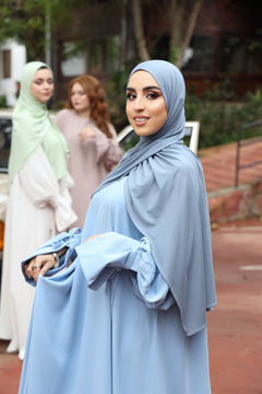 Model wearing CHANO Modesty’s Ash Blue breathable modal jersey hijab, styled with the balloon sleeve dress. 