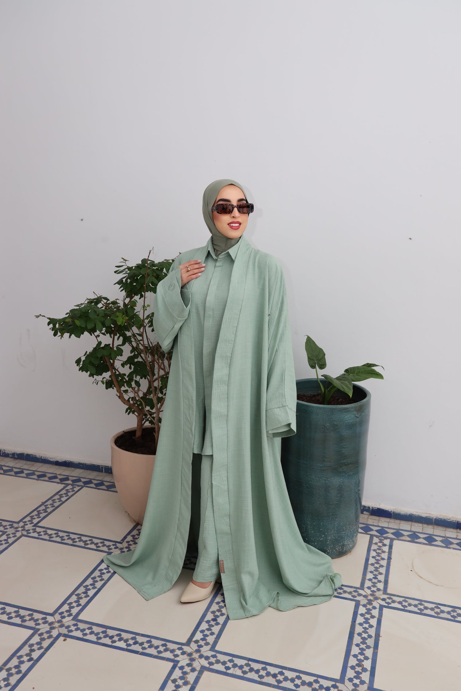 Model wearing CHANO Modesty’s Textured Kimono in a pastel green tone, styled with a matching co-ord set and hijab — lightweight, flowy and elegant for modest wear.