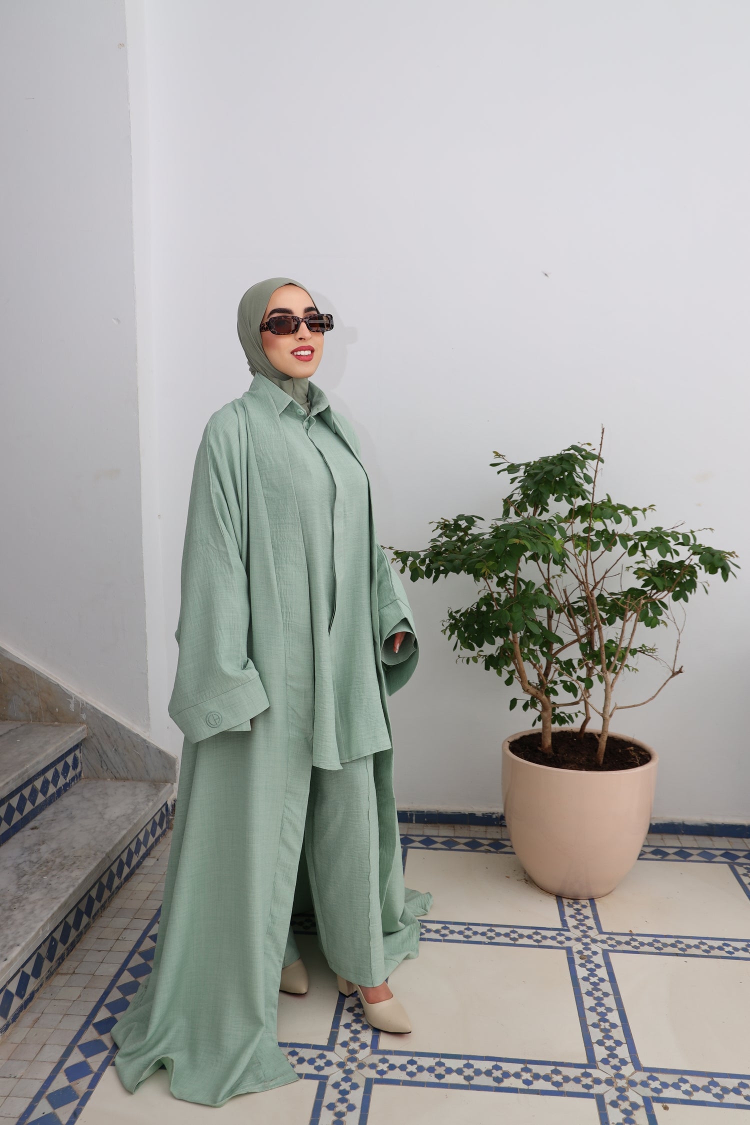 Full modest outfit featuring the CHANO Modesty pastel green Textured Kimono with wide sleeves and a relaxed silhouette, layered over a matching shirt and pants set.