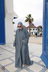 Model wearing CHANO Modesty’s Textured Kimono in a steel blue tone, styled with a matching co-ord set and hijab — lightweight, flowy and elegant for modest wear.