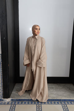 Model wearing CHANO Modesty’s Textured Kimono in a soft beige tone, styled with a matching co-ord set and hijab — lightweight, flowy and elegant for modest wear.