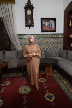 Model wearing CHANO Modesty’s Textured Tunic Dress in caramel, a relaxed modest fit with wide sleeves and a buttoned collar — perfect for effortless elegance.