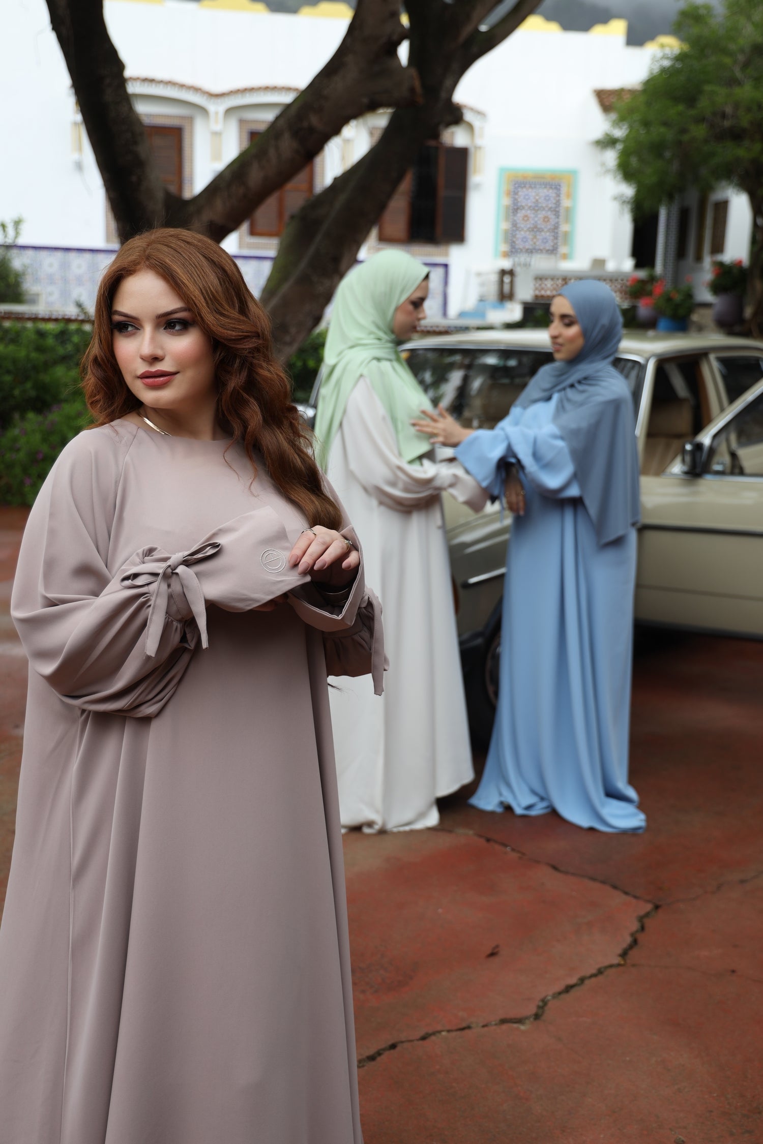 Upper half of the CHANO Modesty Balloon Sleeve Dress in Taupe, showing the relaxed fit and refined draping of the bodice and sleeves.