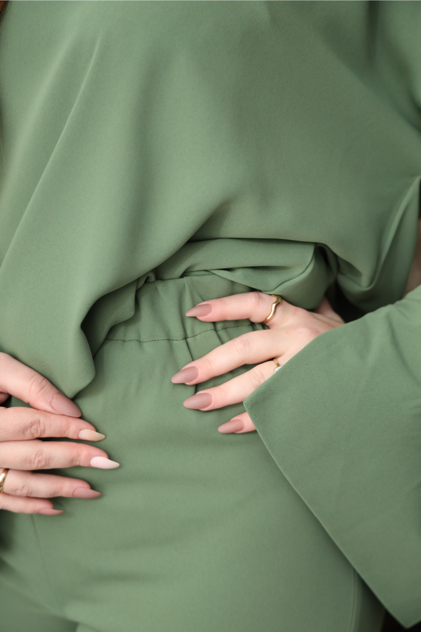 Close-up of the Olive Green trousers showing the soft fabric and comfortable elastic waistband.