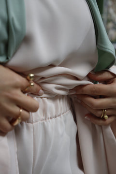 Close-up of the Blush Beige trousers showing the soft fabric and comfortable elastic waistband.