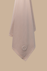 Close-up of the breathable modal jersey hijab in Rosé Sand with embroidered CHANO logo.