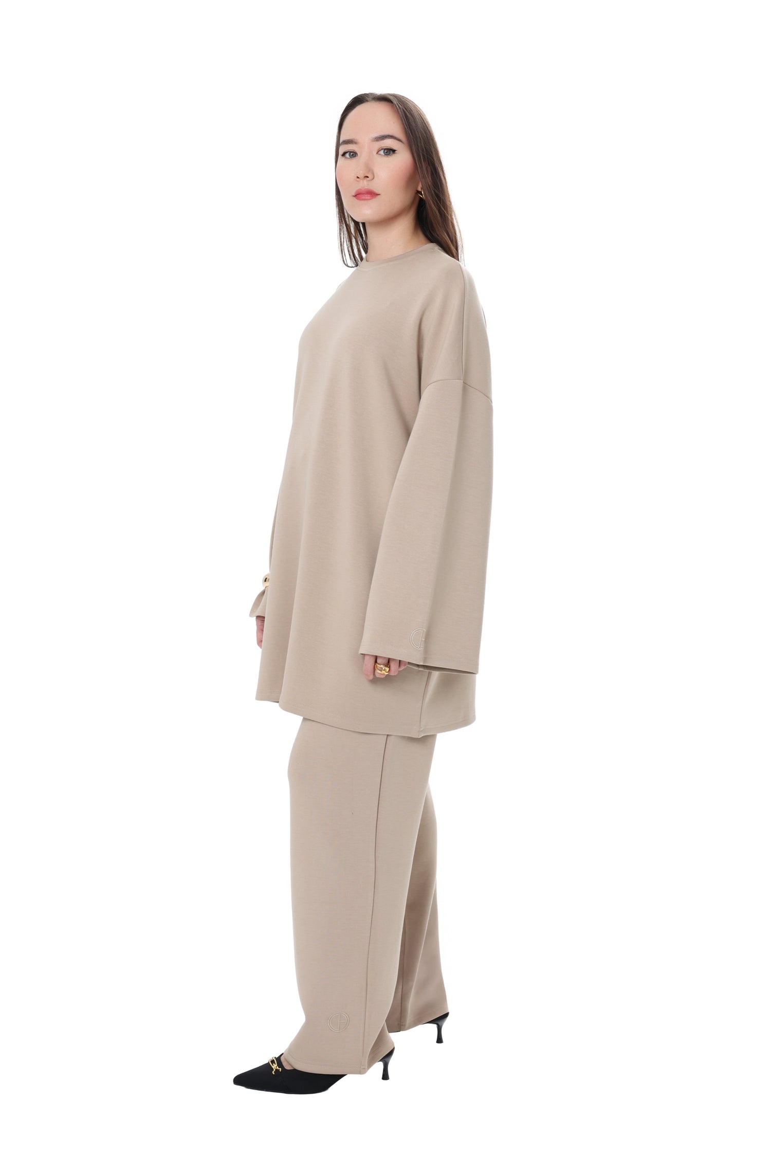 Side view of the Comfy Two-Piece Set in Sand by CHANO Modesty, showing relaxed oversized tunic and modest wide-leg trousers.
