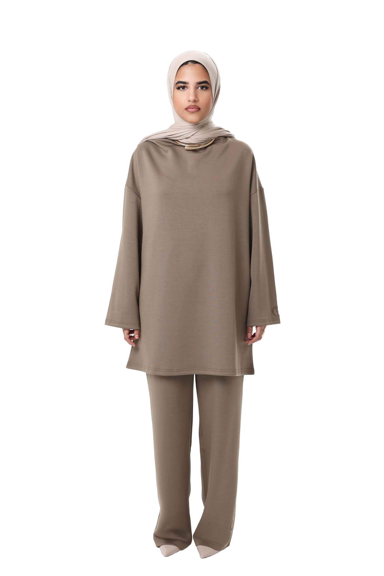 Model wearing the CHANO Comfy Two-Piece Set in Taupe — an oversized tunic with wide sleeves and matching wide-leg trousers, styled with a beige hijab.