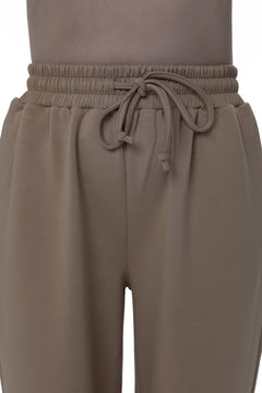 Close-up of the CHANO Comfy Pants in Taupe showing the elastic waistband with adjustable drawstring, made from a soft cotton-blend fabric.
