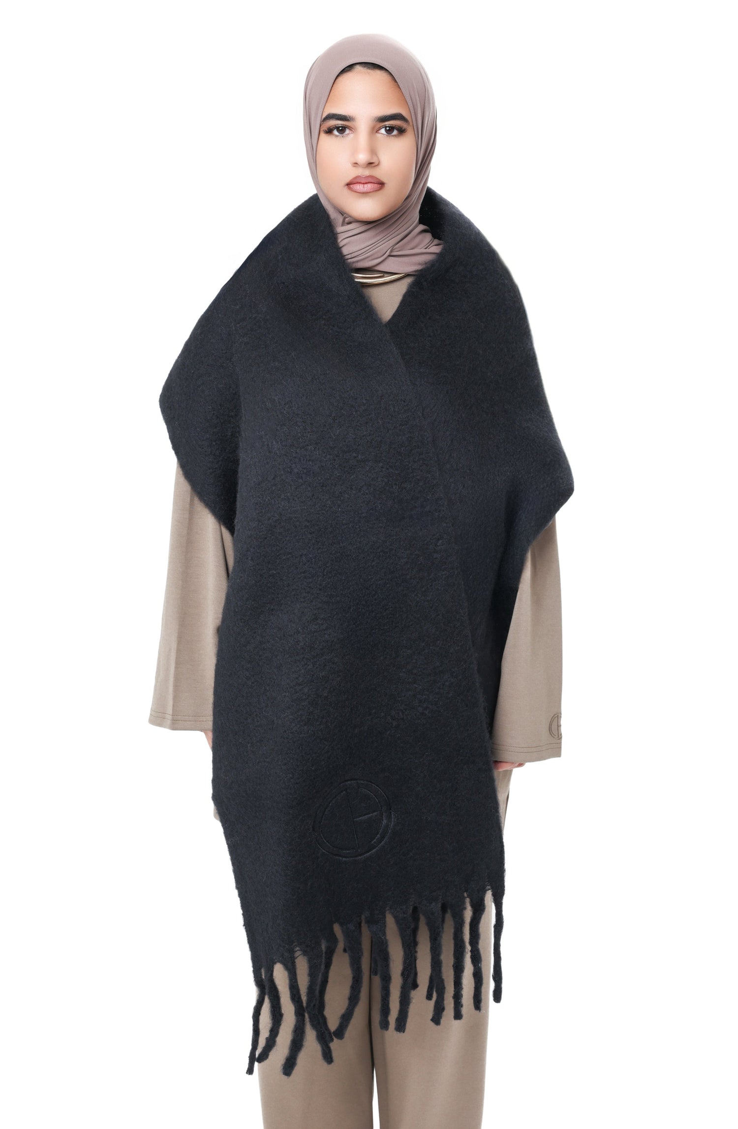 Front view of the Comfy Scarf in Black, showing the oversized design, soft brushed finish, and tone-on-tone logo detail.