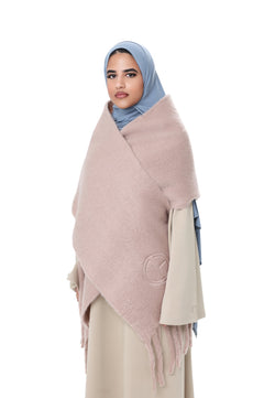 Side angle of the Comfy Scarf in Beige, styled with a light beige outfit and blue hijab, emphasizing the cozy, voluminous design.