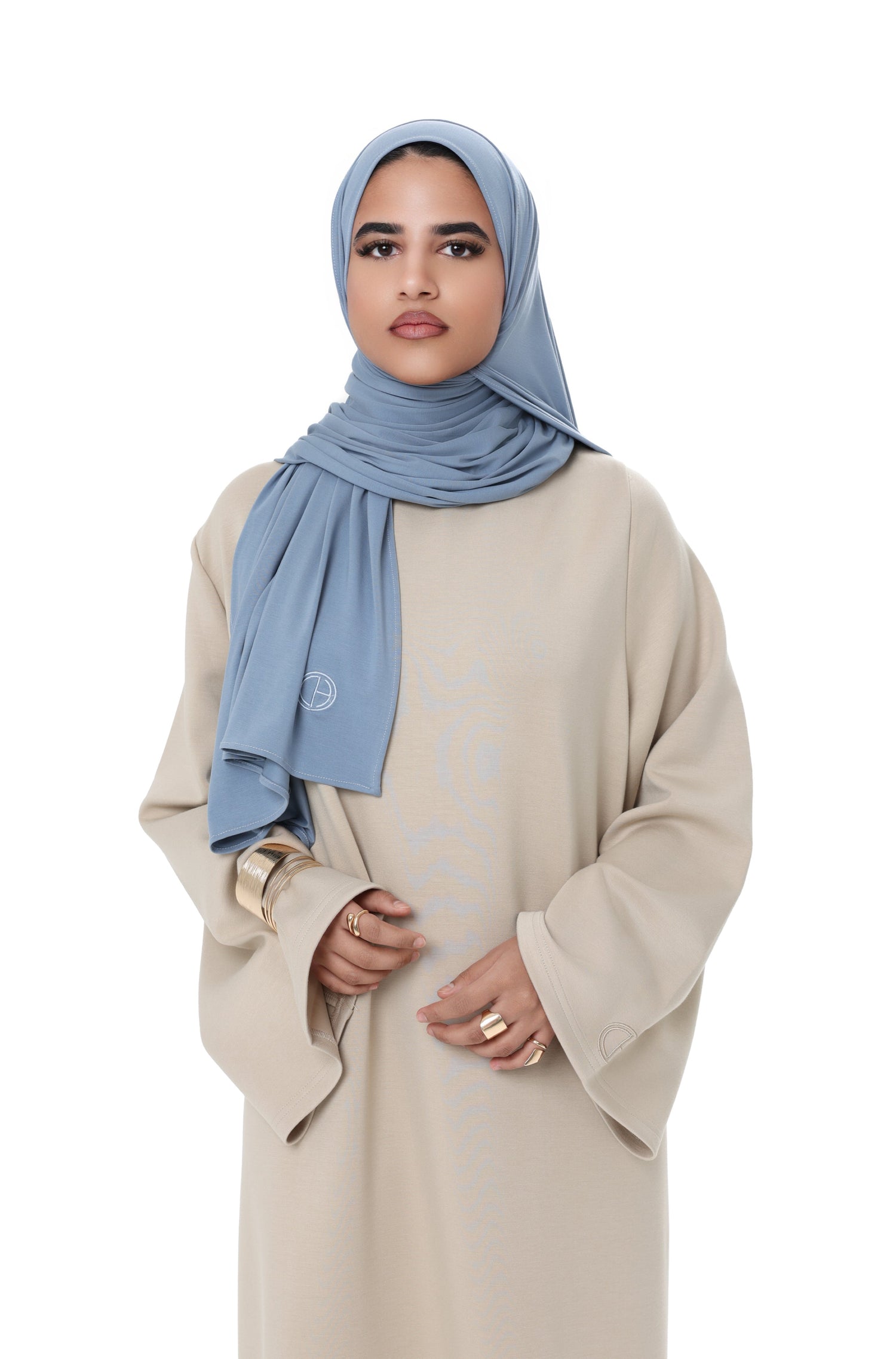 Close-up of the Comfy Dress in Beige, focusing on the soft texture and minimal design with wide sleeves.