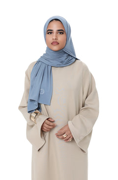 Close-up of the Comfy Dress in Beige, focusing on the soft texture and minimal design with wide sleeves.
