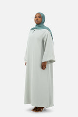Layered abaya set in Misty Blue with flowing silhouette and wide sleeves