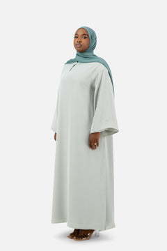 Layered abaya set in Misty Blue with flowing silhouette and wide sleeves