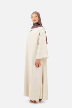 Layered abaya set in Rose Beige with flowing silhouette and elegant wide sleeves