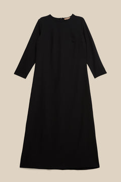 Elevate your modest wardrobe with our elegant two-piece staple abaya set in black. This versatile set includes a long-sleeve dress with a discreet back zipper and a classic abaya overlay that drapes beautifully for a timeless look.